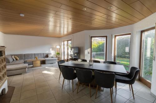 a living room with a table and chairs and a couch at Cozy Holiday Home in Worms