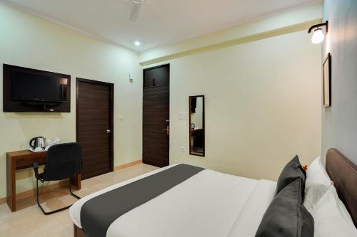 Ένα ή περισσότερα κρεβάτια σε δωμάτιο στο Collection O Hotel Villa Vista