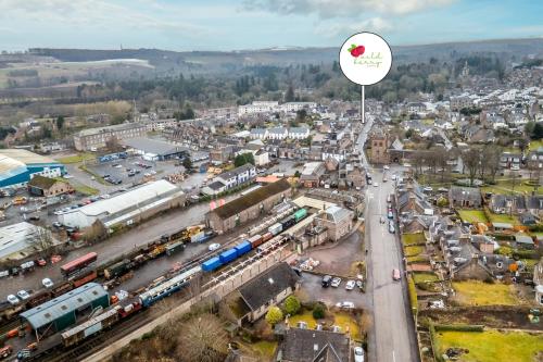 an aerial view of a city with a train station at Wild Berry Stays- Damacre Road in Brechin