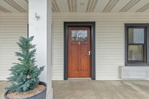 a wooden door on a house with a christmas tree at Blue Star Motel in Douglas