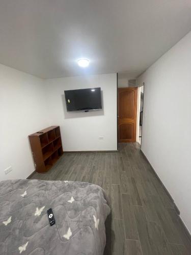 Postel nebo postele na pokoji v ubytování Increíble apartamento norte Tunja