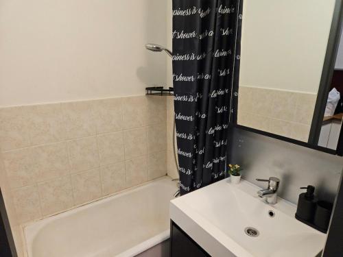 a bathroom with a sink and a tub and a shower at Wali's Nature Bliss Dinant Givet in Waulsort