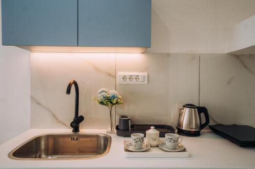 Η κουζίνα ή μικρή κουζίνα στο Vil Apartments