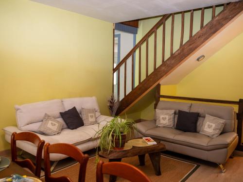 a living room with a couch and a table at Holiday Home Le Havre de Lage by Interhome in Moissannes