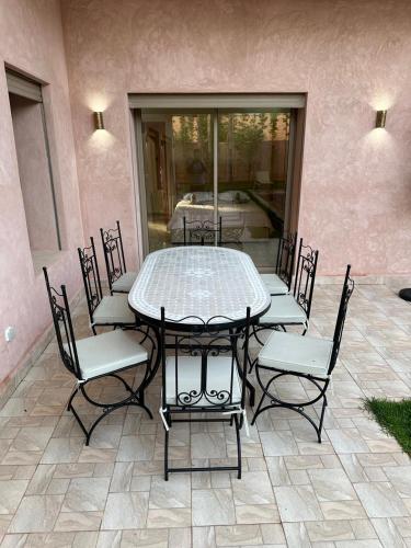 a table and chairs sitting on a patio at Villa Bellevue in Sbiti