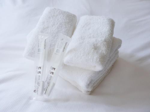 Postel nebo postele na pokoji v ubytování Garden Otsuka