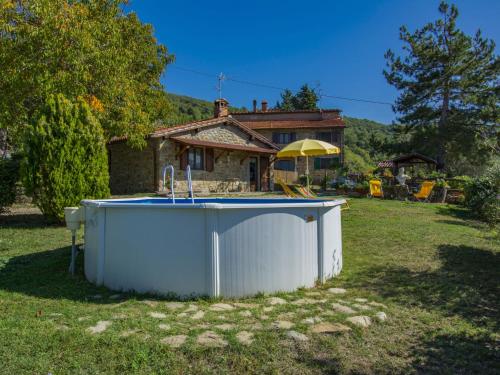 a large tub in the yard of a house at Holiday Home Il Poderino by Interhome in Londa