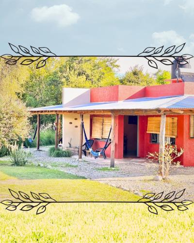 a house with a hammock in front of it at Cielos Abiertos in La Paz