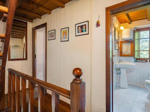 a staircase leading to a bathroom with a toilet and a sink at Holiday Home Vincio by Interhome in Culla