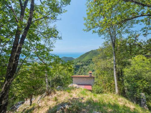 a house on top of a hill with trees at Holiday Home Vincio by Interhome in Culla