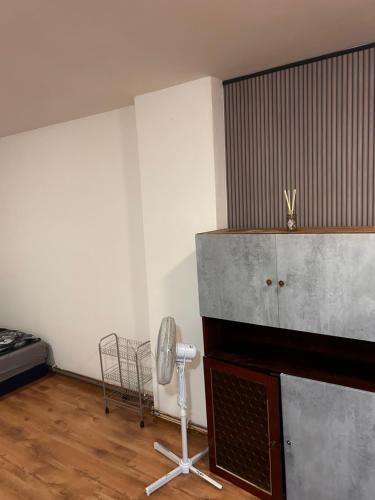 a room with a room with a fan and a bed at Apartments Bílina in Teplice