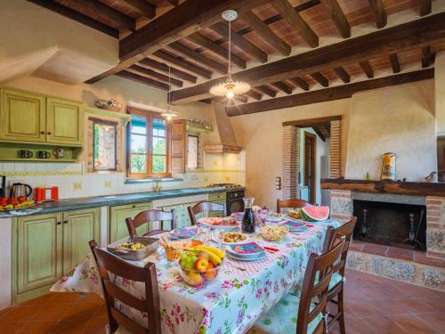 a kitchen with a table with fruit on it at Holiday Home I Pioppi - CMA109 by Interhome in Camaiore