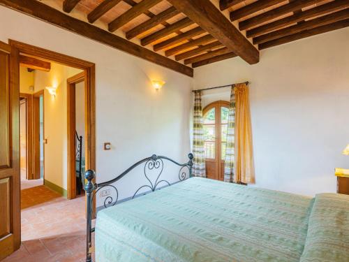 a bedroom with a blue bed in a room at Holiday Home I Pioppi - CMA109 by Interhome in Camaiore