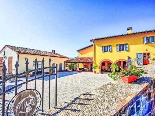 a building with a fence in front of it at Holiday Home Antico Loggiato by Interhome in Pontassieve