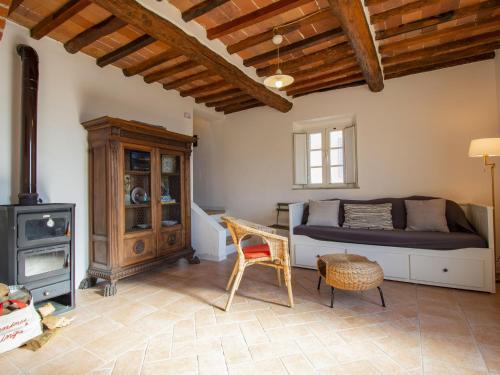 a living room with a bed and a stove at Apartment Azalea by Interhome in Spianate