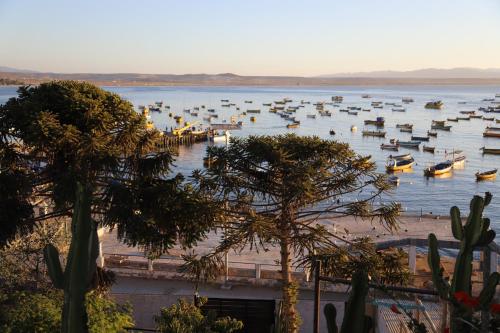 a large body of water with boats in it at Preciosa casa frente al mar in Tongoy