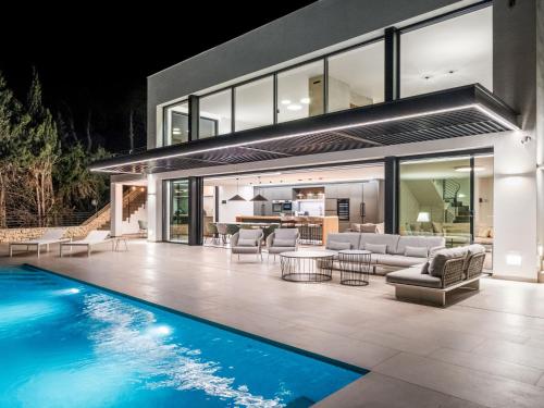 an open living room and swimming pool in a house at Villa Cabo de Gata by Interhome in Moraira