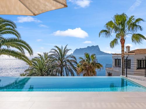 a swimming pool in a villa with a view of the ocean at Villa Cabo de Gata by Interhome in Moraira