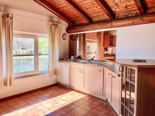 a kitchen with a sink and a window at Apartment Lucia by Interhome in San Cassiano