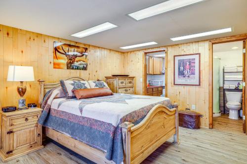 a bedroom with a bed and a bathroom at 2 Mi to Main Street Mtn-View Escape in Lander! in Lander