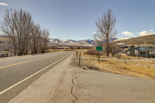 an empty road with mountains in the background at 2 Mi to Main Street Mtn-View Escape in Lander! in Lander