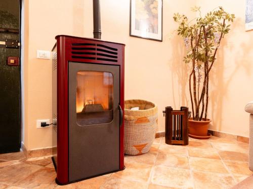 a refrigerator with a fire inside of it at Holiday Home S-Caterina by Interhome in Cervo