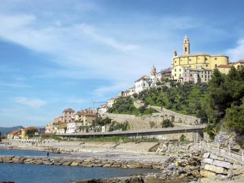 a building on top of a hill next to a river at Holiday Home S-Caterina by Interhome in Cervo
