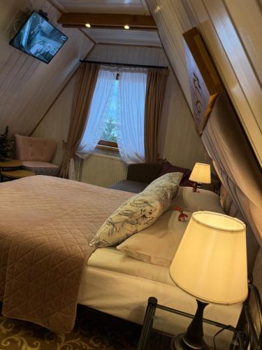 ECO Willa Karpatia Ski&Wellnessにあるベッド