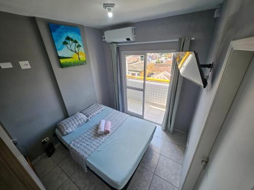 Кровать или кровати в номере Stúdio Aconchegante na Vila Tupi PG