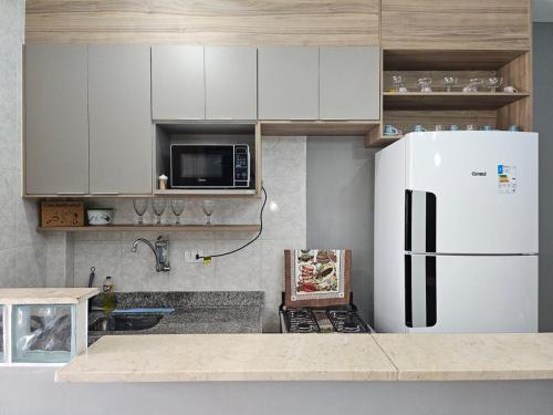 Кухня или мини-кухня в Stúdio Aconchegante na Vila Tupi PG
