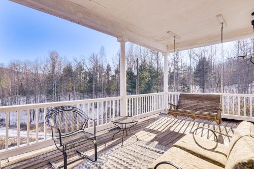 a porch with a couch and a bench on it at Family Home with Game Room and Decks in Etlan! in Etlan