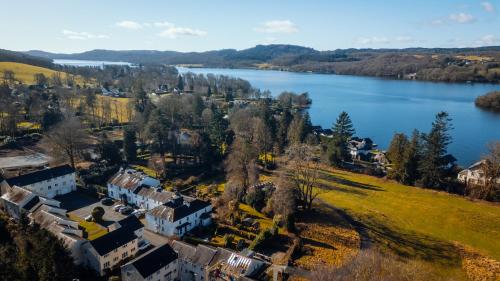 an aerial view of a house next to a lake at Camellia Cottage With Private Garden in Bowness-on-Windermere