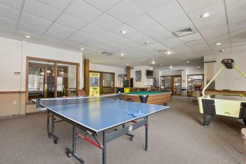 a large room with a ping pong table in it at Lincoln Condo with slope view in Lincoln
