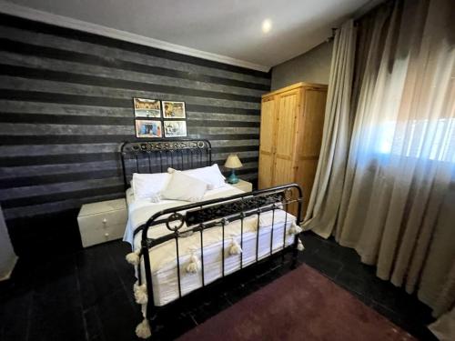 Ein Bett oder Betten in einem Zimmer der Unterkunft Maison d 'Hôtes de Charme 7 Ch