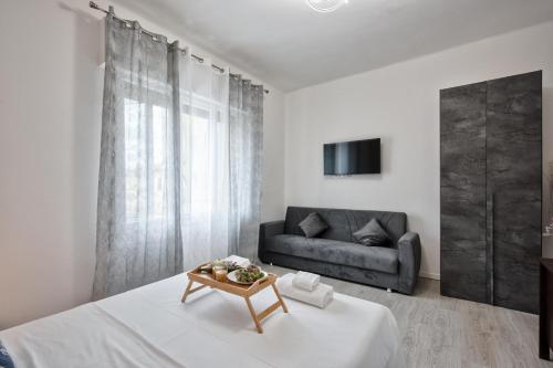 TV a/nebo společenská místnost v ubytování La Venezia Station Residence Mestre