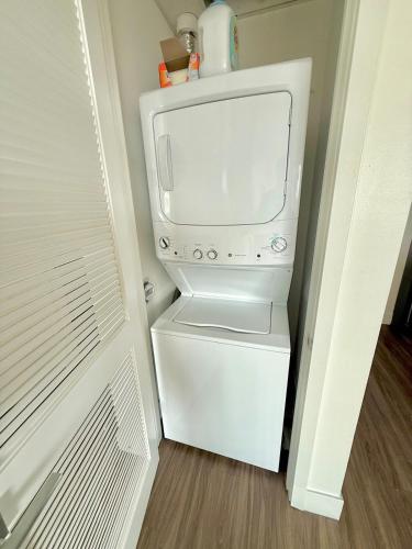 a white refrigerator with a microwave in a room at Top Floor Hollywood 1BR Condo with Views in Los Angeles