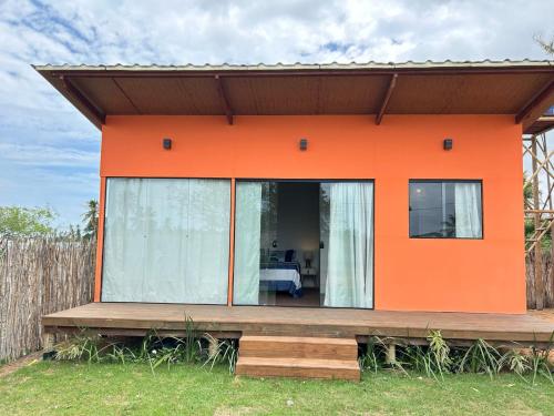 an orange house with an orange at Cabanas em Gostoso WindVacances in Touros