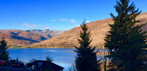 a view of a lake with mountains in the background at Blythedale House in Fort William