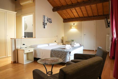Postel nebo postele na pokoji v ubytování Honey Rooms Ferrara