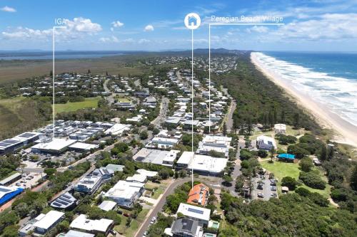an aerial view of a beach with houses at Parkside on Plover Street in Peregian Beach