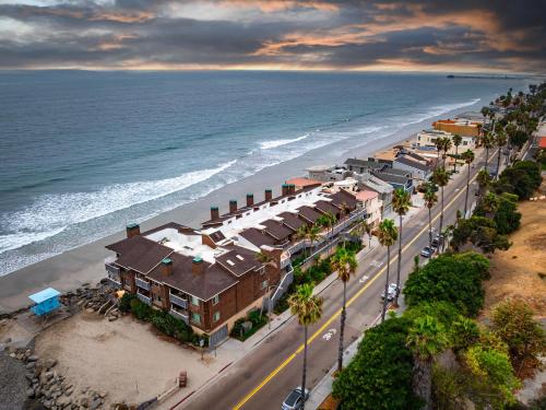 an aerial view of a town on the beach at Luxury Oceanfront Condo with Private Beach Access in Oceanside
