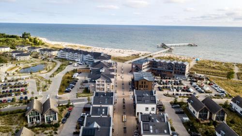 an aerial view of a resort next to the beach at Ostsee - Appartement Nr 65 "Seaside" inkl Strandkorb im Strand Resort in Heiligenhafen