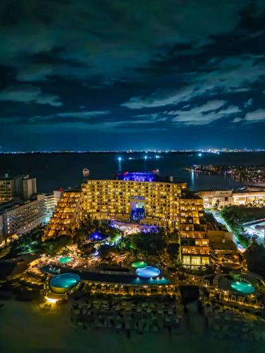 a view of a resort at night at Live Aqua Cancun - Adults Only - All-Inclusive in Cancún