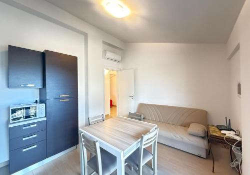 a living room with a table and a couch at Semplice BnB Bonagia in Valderice