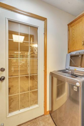 a kitchen with a window and a microwave at Relax at the Summit - 3bd 2b in Springfield