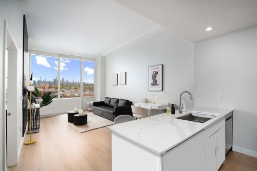 Posezení v ubytování Exclusive 1BR Apt with NYC View