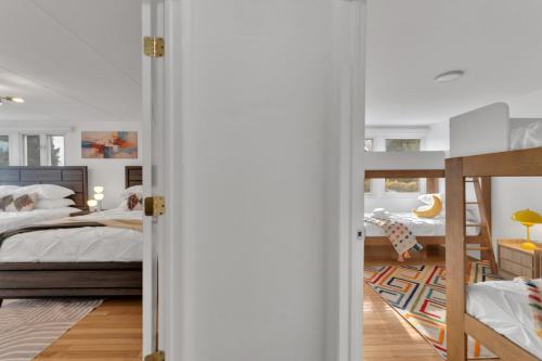 a bedroom with a bunk bed and a bunk bed at Fire and Fun Luxe Stay w Pool Hot Tub and Game Room in Linden