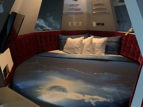 a bed in the back of a train at Don Q Inn in Dodgeville