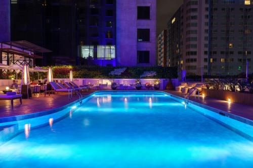 a swimming pool at night with blue lights at Intercontinental Real Guatemala by IHG in Guatemala