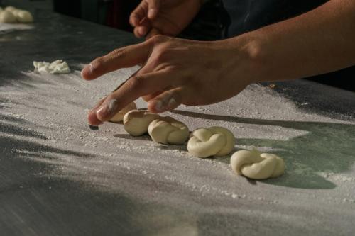 a person picking up a bunch of uncooked dough at Intercontinental Real Guatemala by IHG in Guatemala